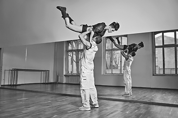 Image showing beautiful couple dancing bachata in dance studio
