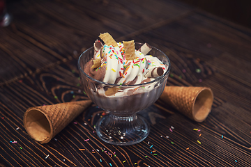 Image showing Ice-cream on wooden