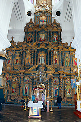 Image showing people in the church near beautiful iconostasis