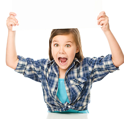 Image showing Little girl is holding a blank banner