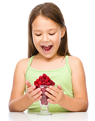 Image showing Little girl with raspberries