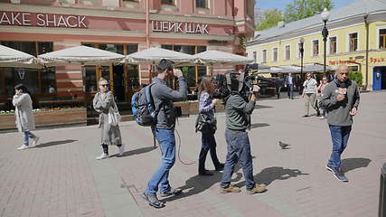 Image showing MOSCOW - JUNE 7: The film crew interviews the seller of ice cream on June 7, 2017 in Moscow, Russia. UltraHD stock footage