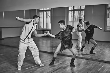 Image showing beautiful couple dancing bachata in dance studio