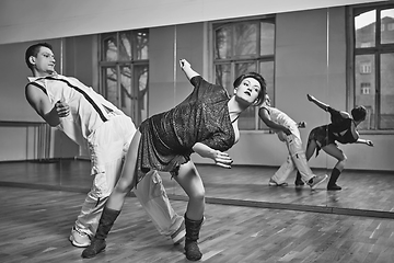 Image showing beautiful couple dancing bachata in dance studio