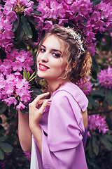 Image showing girl in dress in rhododendron garden