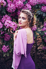 Image showing girl in dress in rhododendron garden