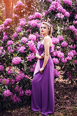 Image showing girl in dress in rhododendron garden