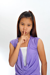 Image showing young asian with finger on her lips
