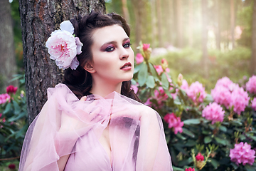 Image showing girl in dress in rhododendron garden