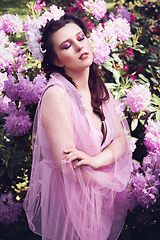 Image showing girl in dress in rhododendron garden