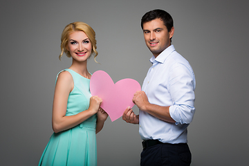 Image showing Beautiful couple holding pink heart