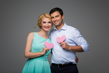 Image showing Beautiful couple holding pink hearts