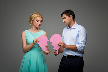 Image showing Beautiful couple holding pink broken heart