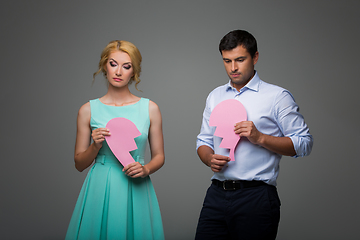 Image showing Beautiful couple holding pink broken heart