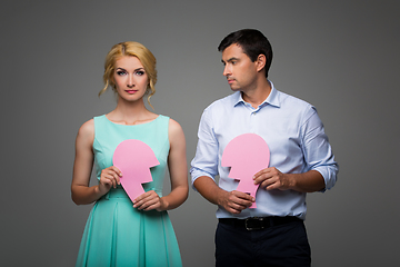 Image showing Beautiful couple holding pink broken heart