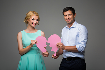 Image showing Beautiful couple holding pink broken heart