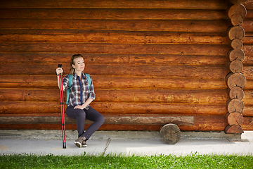 Image showing young woman with nordic walk pols