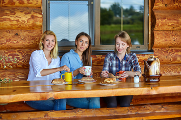 Image showing young women drinking tea