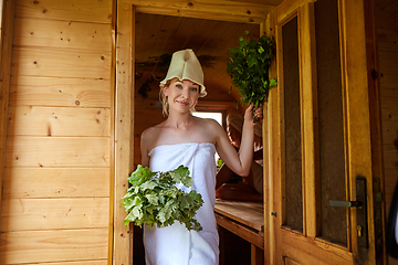 Image showing beautiful girl relaxing in sauna