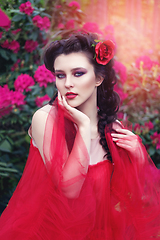 Image showing girl in dress in rhododendron garden