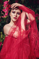 Image showing girl in dress in rhododendron garden