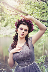 Image showing girl in dress in rhododendron garden