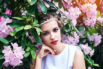 Image showing girl in dress in rhododendron garden