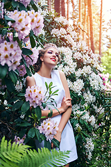 Image showing girl in dress in rhododendron garden