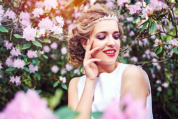 Image showing girl in dress in rhododendron garden