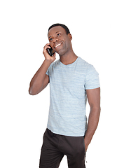 Image showing Man talking and smiling at his phone