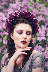 Image showing girl in dress in rhododendron garden