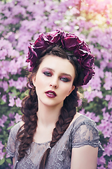 Image showing girl in dress in rhododendron garden