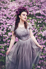 Image showing girl in dress in rhododendron garden