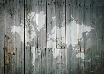 Image showing World map on a wooden wall