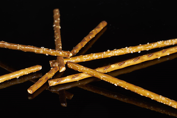 Image showing salt sticks on dark ground