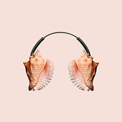 Image showing Contemporary art collage, modern design. Summer mood. Headphones made of shells on pastel brown