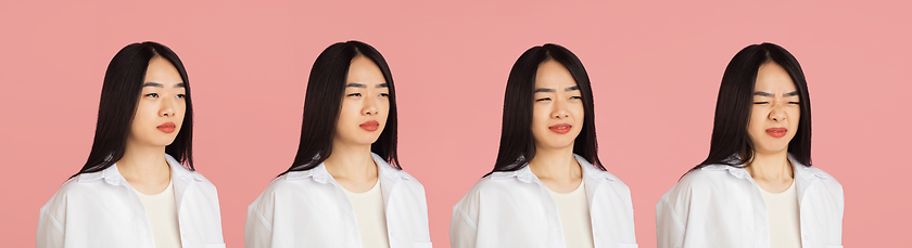 Image showing Evolution of emotions. Asian young woman\'s portrait on pink studio background. Concept of human emotions, facial expression, youth, sales, ad.