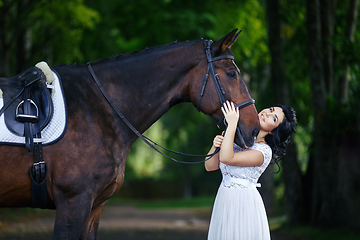 Image showing beautiful girl in dress with horse