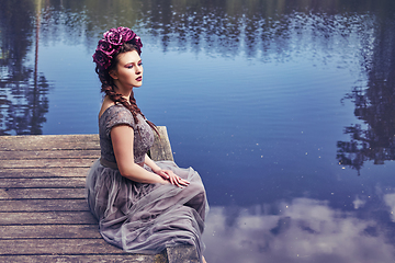 Image showing girl in dress in rhododendron garden