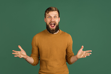 Image showing Caucasian man\'s portrait isolated over green studio background with copyspace