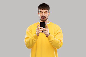 Image showing young man with smartphone