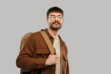 Image showing young man in glasses with backpack