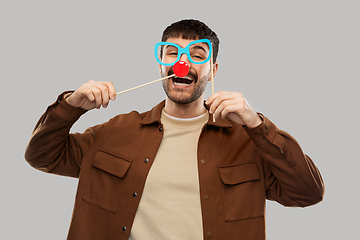 Image showing happy smiling man with glasses and red clown nose