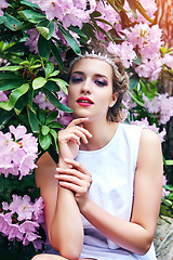 Image showing girl in dress in rhododendron garden