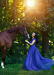 Image showing beautiful girl in dress with horse