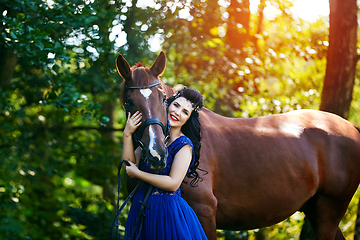 Image showing beautiful girl in dress with horse