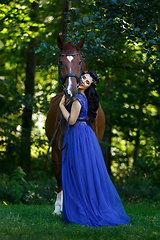 Image showing beautiful girl in dress with horse