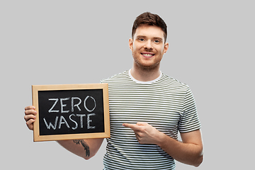 Image showing smiling man holding chalkboard with zero waste