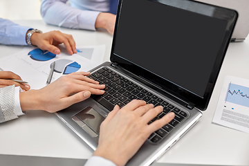 Image showing close up of businesspeople with laptop at office