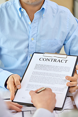 Image showing customer signing contract document at office